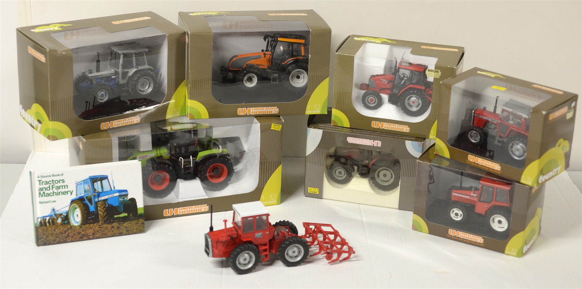 Die-cast model tractors.