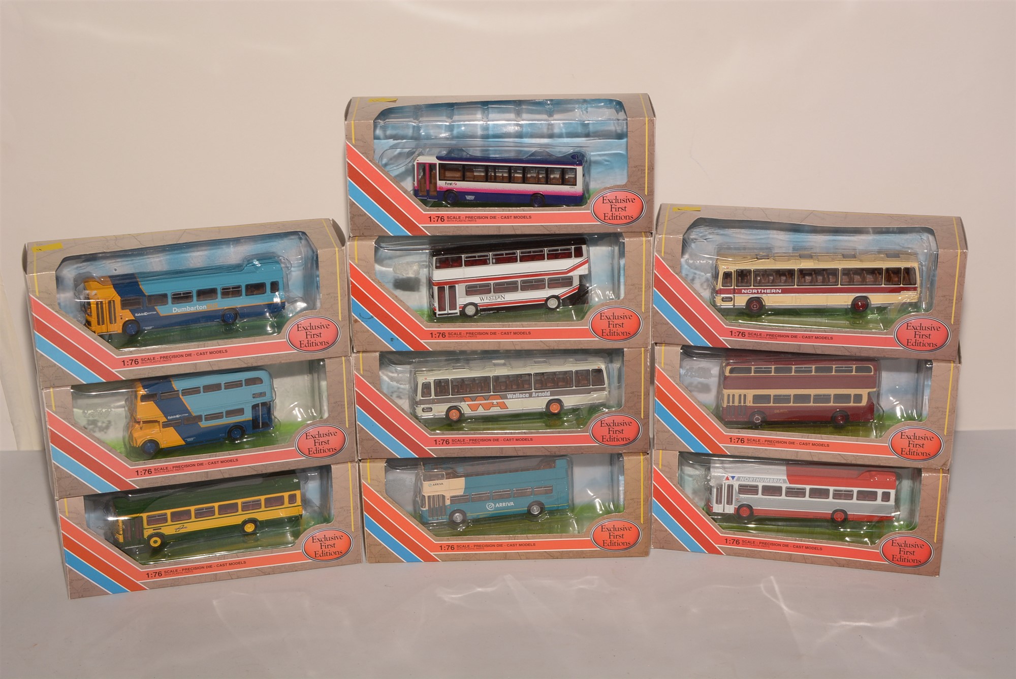 Die-cast model buses by Exclusive First Editions.