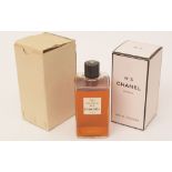 A 16oz. (Grand Modele) vintage bottle of Chanel No 5 eau de cologne splash.