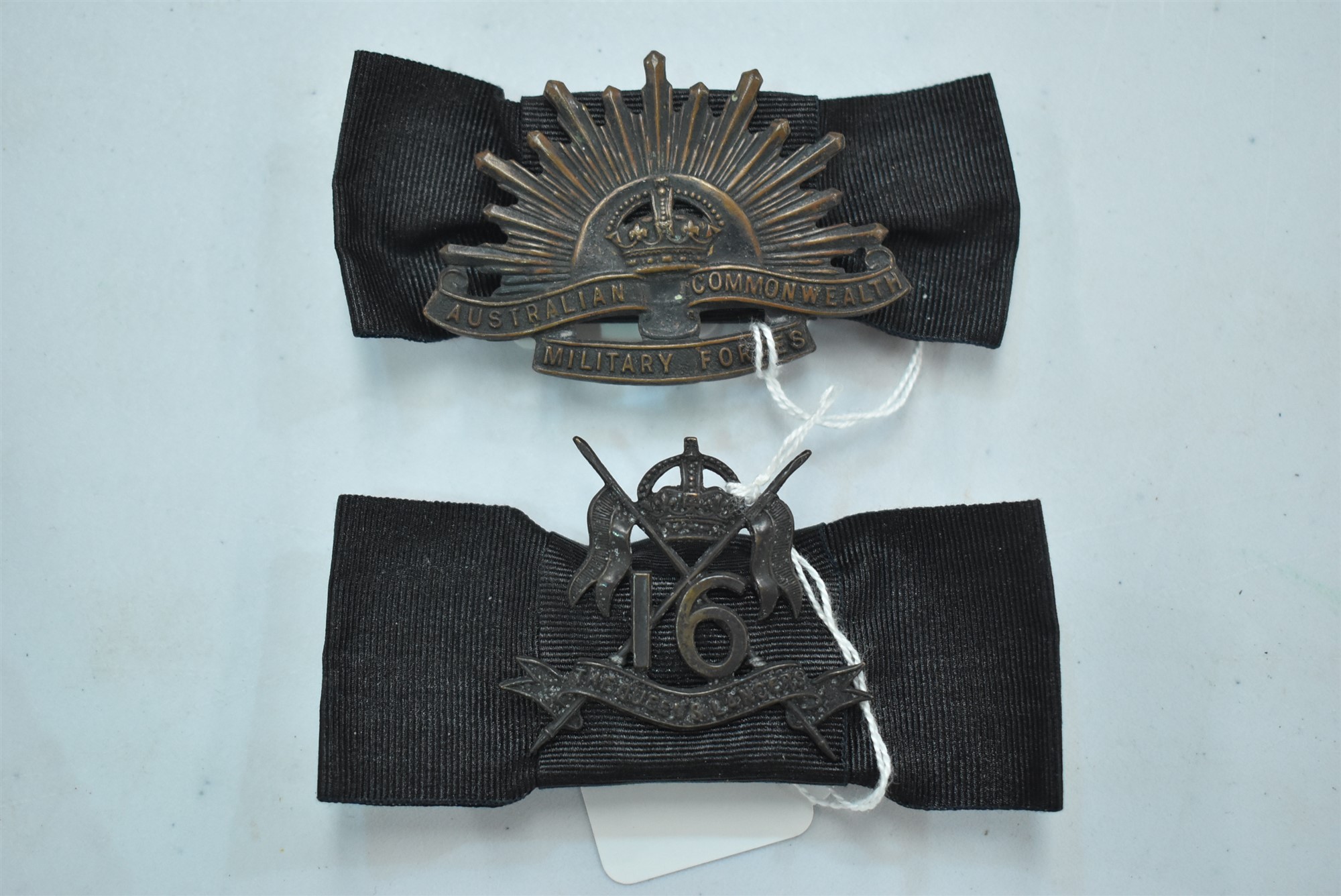Two military badges
