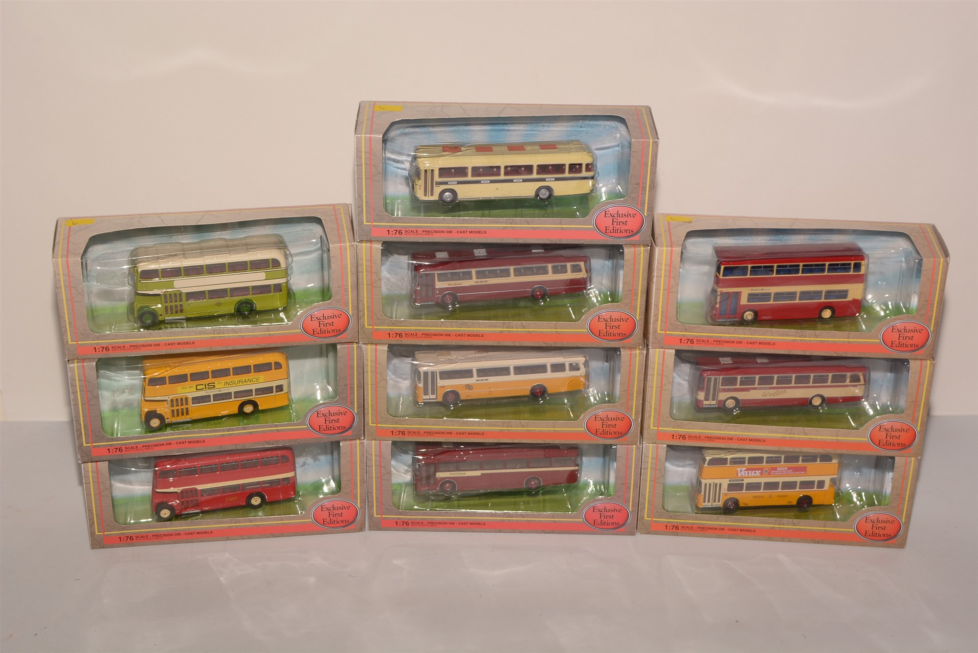 Die-cast model buses by Exclusive First Editions.