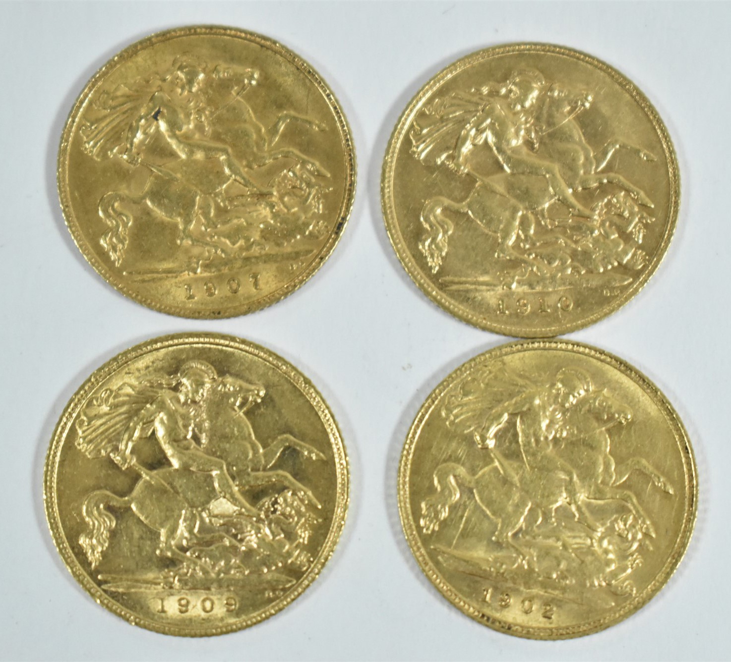 Four gold half sovereigns