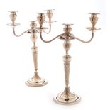 A pair of plated candelabra