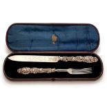 A Victorian silver bread knife and fork, by John Gilbert, Birmingham 1867, the handle with leaf