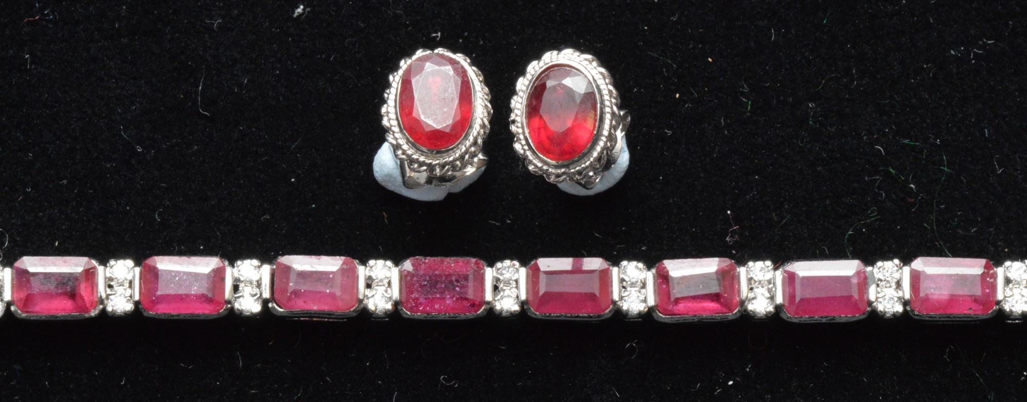 A ruby and diamond bracelet and earrings