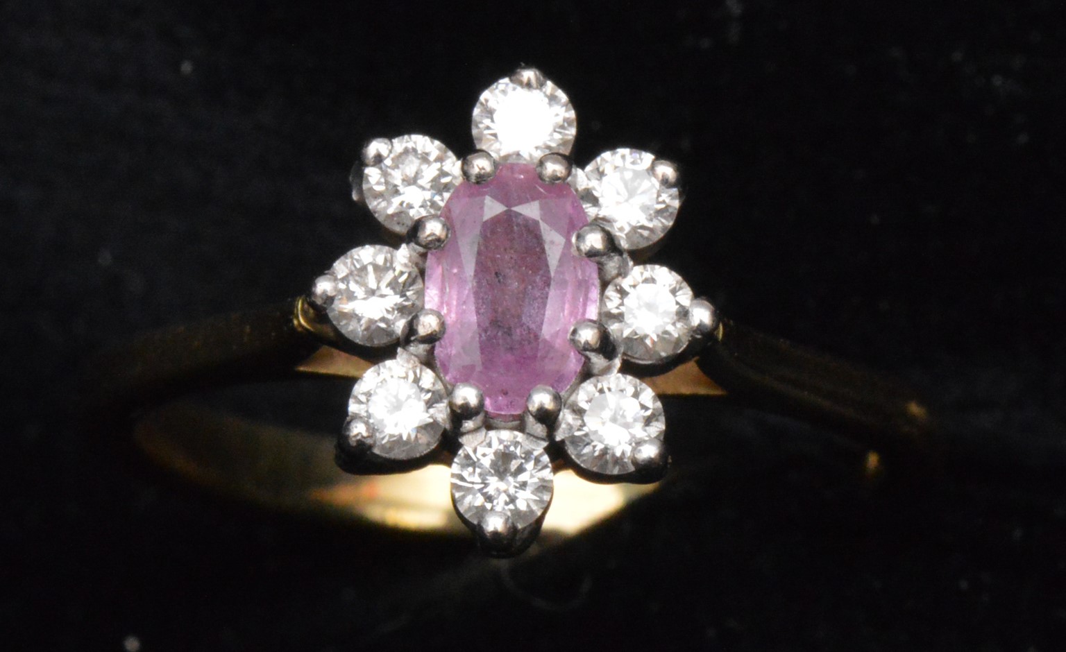 Pink sapphire and diamond ring