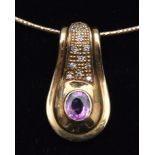 Pink sapphire and diamond pendant