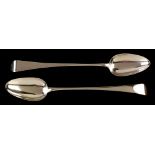 A pair of silver gravy spoons