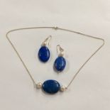 A lapis lazuli and cultured pearl pendant necklace on yellow metal link chain stamped 9ct to/w