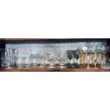 A box of assorted drinking glasses including six long stemmed smokey liquour glasses and eight