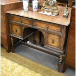 Jacobean style oak dressing table with four drawers raised on barley twist supports united by