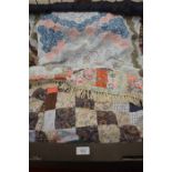 A patchwork tablecloth, a patchwork quilt, patchwork door curtain and a patchwork hanging