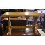 Refectory style elm coffee table on trestle supports united by a central stretcher
