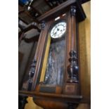 An American walnut twin train drop dial wall clock with enamel dial