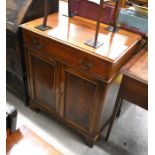 A 19th century mahogany side cabinet with single drawer and panelled cupboard doors raised on