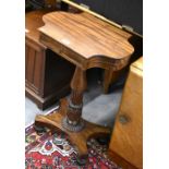 Rosewood and mahogany  occasional table with single frieze drawer, raised on a turned column and