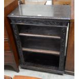 Small carved oak open bookcase with two shelves