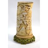 A late 19th/early 20th century porcelain vase in the form of an elephant ivory tusk, possibly