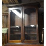 Mahogany bookcase with a pair of glazed doors enclosing three shelves