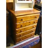 Ducal pine chest of five long drawers with turned pulls raised on bun feet