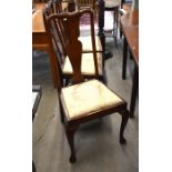 A set of six mahogany Queen Anne style vase back dining chairs with pad seats and cabriole front