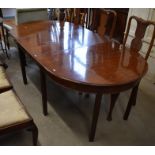 Georgian style mahogany extending dining table, the oval top with single central leaf raised on