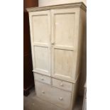 A Victorian painted pine cupboard of child friendly proportions, the pair of panelled doors over two