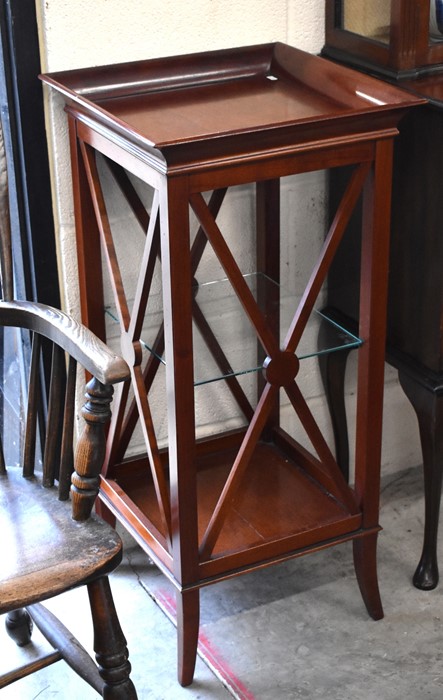 A mahogany square occasional table with open glass shelf