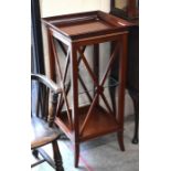 A mahogany square occasional table with open glass shelf