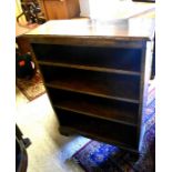 A good quality oak open bookcase with three shelves, raised on bracket feet