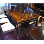 Mahogany extending dining table with two leaves, raised on cabriole supports to/w a set of six