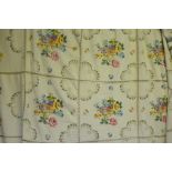 A large linen tablecloth, the panels embroidered with floral sprays with ladder-work and blanket