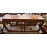 1970's teak rectangular coffee table on shaped supports with a pair of smaller nesting tables