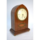 An Edwardian walnut dome cased eight-day mantel clock with white enamelled convex dial and shell