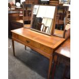 A Stag oak dressing table with triptych mirror back over three drawers raised on tapering square