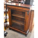 A 19th century inlaid walnut and ormolu mounted pier cabinet with single glazed door enclosing two