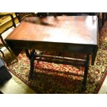 A Regency style mahogany sofa table with two frieze drawers, raised on lyre style supports