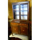 Edwardian inlaid mahogany library bookcase with glazed doors enclosing shelves over two drawers