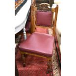 A set of four Edwardian dining chairs with burgundy leather style upholstery
