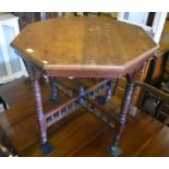 An Edwardian mahogany octagonal table with 'gallery' stretcher a/f
