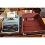 An Olivetti Studio 44 typewriter in case, c/w manual