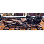 A South East Asian, Acacia wood sculpture of two recumbent lovers