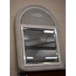 A white painted wicker framed wall mirror