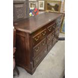 An oak mule chest with nine dummy drawers