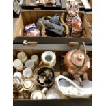 Two boxes to include two Imari models of cats, a camera, carriage lamp, copper kettle on stand,