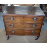 19th century mahogany chest of three long drawers raised on turned legs with castors