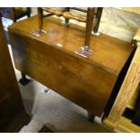 A 19th century mahogany drop leaf table with gate leg action supports