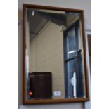 A rectangular mahogany framed bevelled edge wall mirror and an oval Regency style wall mirror (2)