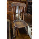 A Victorian oak elm seat rocking chair in cottage patinated condition