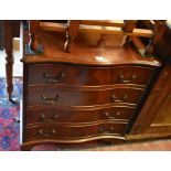 Georgian style serpentine small chest of four drawers, raised on bracket feet